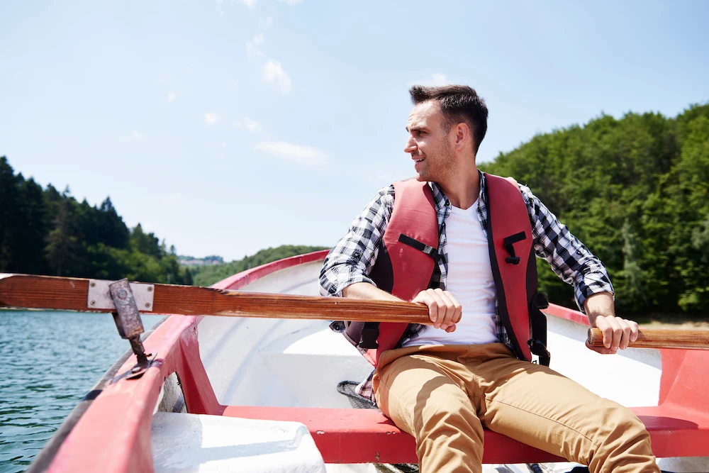 Person enjoying a boating trip on a lake