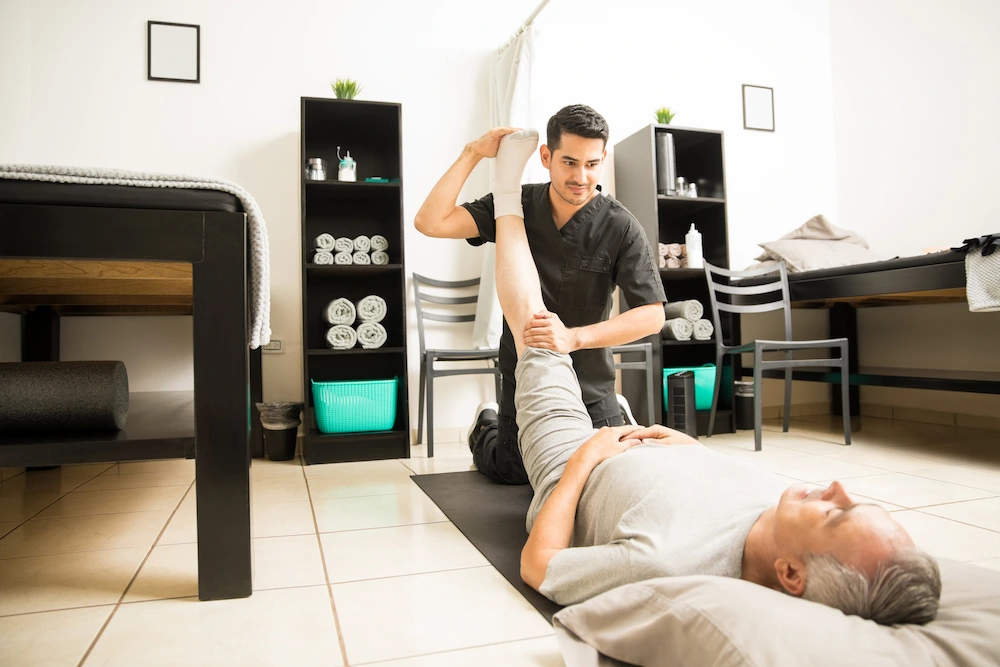 Chiropractor consulting patient in South Bend clinic