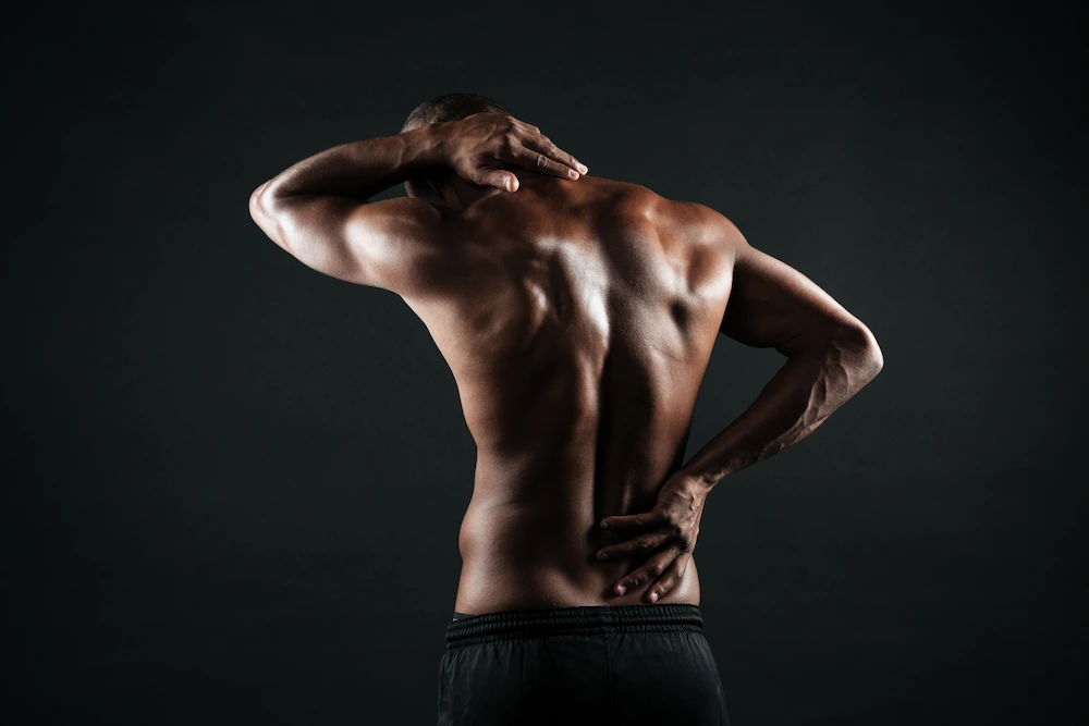 Man suffering from lower back pain in South Bend